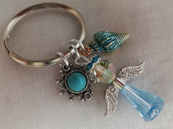 Sleutelhanger Swarovski beschermengel, turkoois zon en schelp