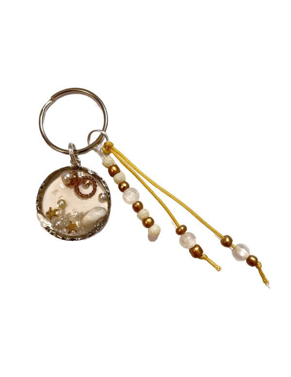 Zomer sleutelhanger schelp parel goud